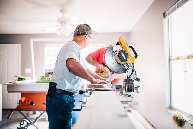 carpenter using saw